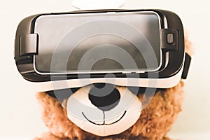 Teddy Bear wearing a virtual reality headset.