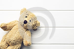 Teddy bear on white table