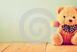 Teddy bear on wooden table