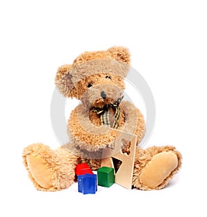 Teddy bear with wooden toys