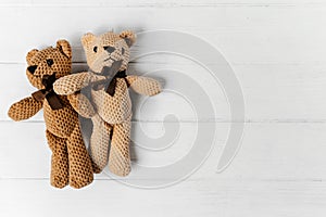 teddy bears close up on the white wooden background.