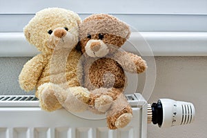 Teddy bears on the heater