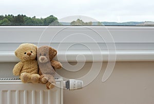 Teddy bears on the heater