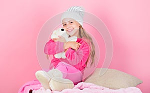 Teddy bears improve psychological wellbeing. Kid cute girl play with soft toy teddy bear pink background. Child small
