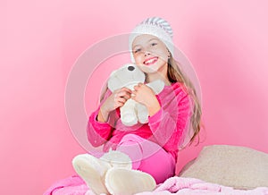 Teddy bears improve psychological wellbeing. Kid little girl play with soft toy teddy bear pink background. Child small