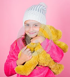 Teddy bears improve psychological wellbeing. Kid little girl play with soft toy teddy bear pink background. Unique