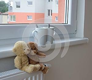 Teddy bears on radiator