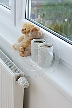 Teddy bears on radiator