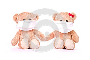 Teddy bears is wearing a PM 2.5 pollution masks and protect virus on white background. Health care concept