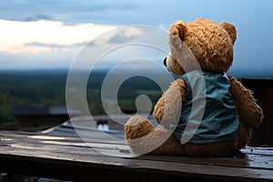 Teddys blues alone on a wooden balcony, appearing melancholic