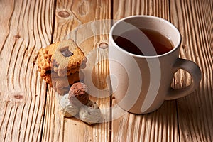 tee and cookies on a wooden table