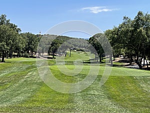 Tee shot of long golf hole with beautiful green grass