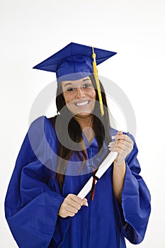 Beautiful Caucasian woman wearing a blue graduation gown holding diploma photo