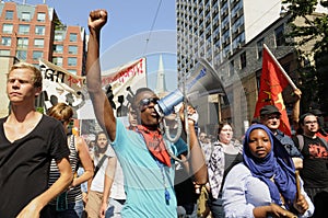 Teen activists shouting with a megaphone.