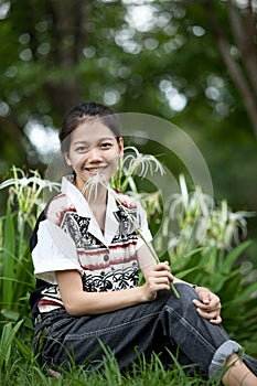 Teen age sitting in the park