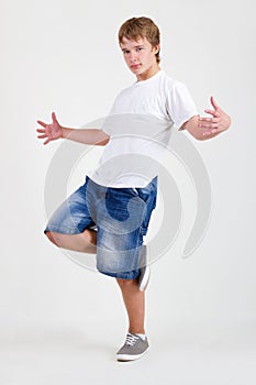 Teen b-boy dancing on white