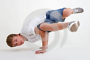 Teen b-boy standing in freeze on white