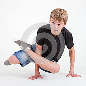 Teen b-boy standing in freeze on white