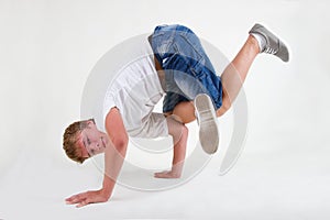 Teen b-boy standing in freeze on white