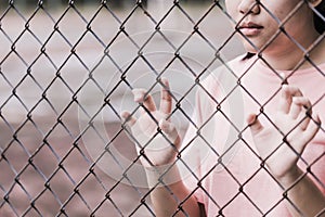 Teen behind the cage or woman jailed photo