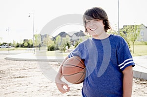 Teen boy with basketball