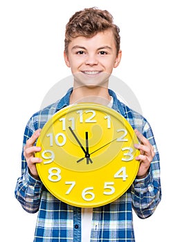 Teen boy with big clock