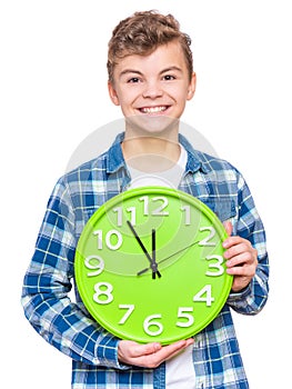 Teen boy with big clock