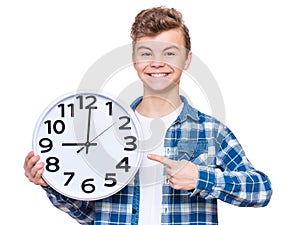 Teen boy with big clock