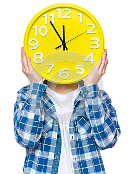 Teen boy with big clock