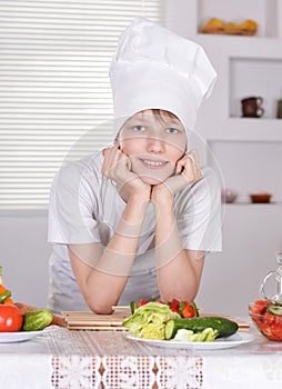 Teen boy in chefs hat