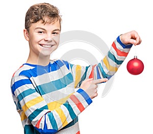 Teen boy with Christmas ball