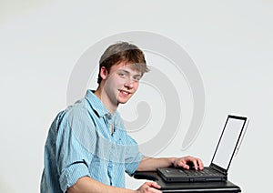 Teen boy at computer