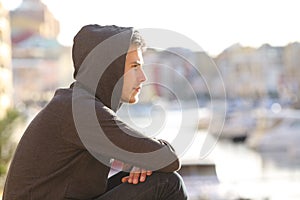 Teen boy contemplating a port on vacation photo