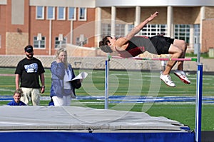 Teen Boy Doing the High Jump at Track Meet