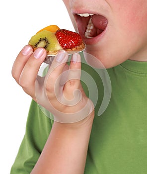 Teen boy eating tartlet photo