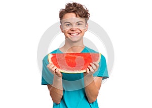 Teen boy eating watermelon