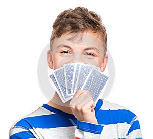 Teen boy with gamble cards