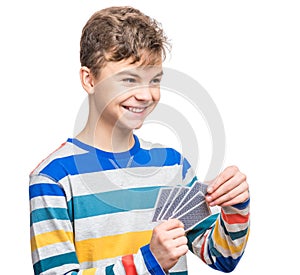 Teen boy with gamble cards