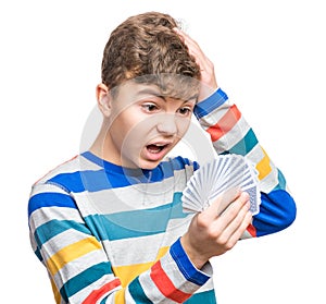 Teen boy with gamble cards