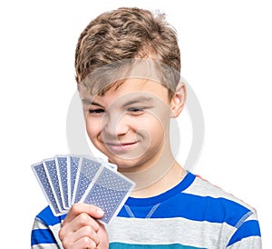 Teen boy with gamble cards