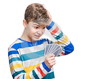 Teen boy with gamble cards