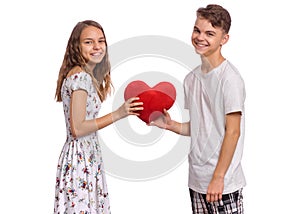 Teen boy and girl on white