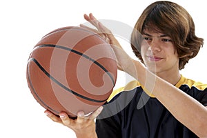 Teen Boy Holding Basket Ball Over White
