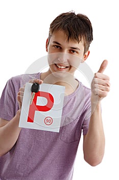 Teen boy holding P plates and car key