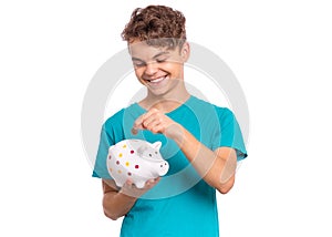 Teen boy holding piggy bank