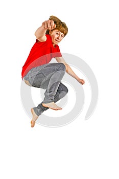 Teen boy jumps up in the air