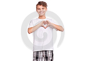 Teen boy making heart hands