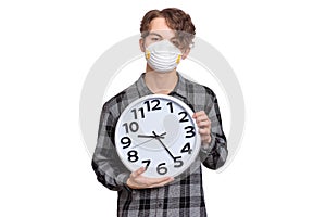 Teen boy in mask with clock
