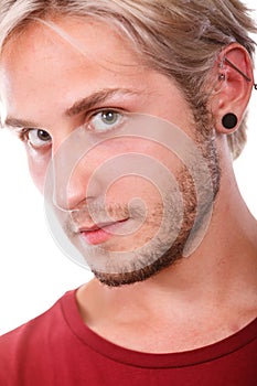 Teen boy with piercing and fashionable hairstyle