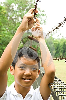 Teen boy with pimpled face posing outdoor